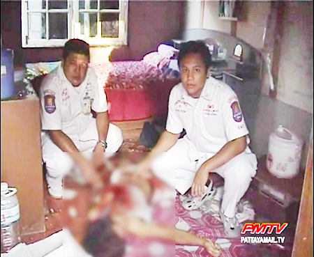 Paramedics attend to the dead man.